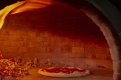 pizza-in-oven-with-fire